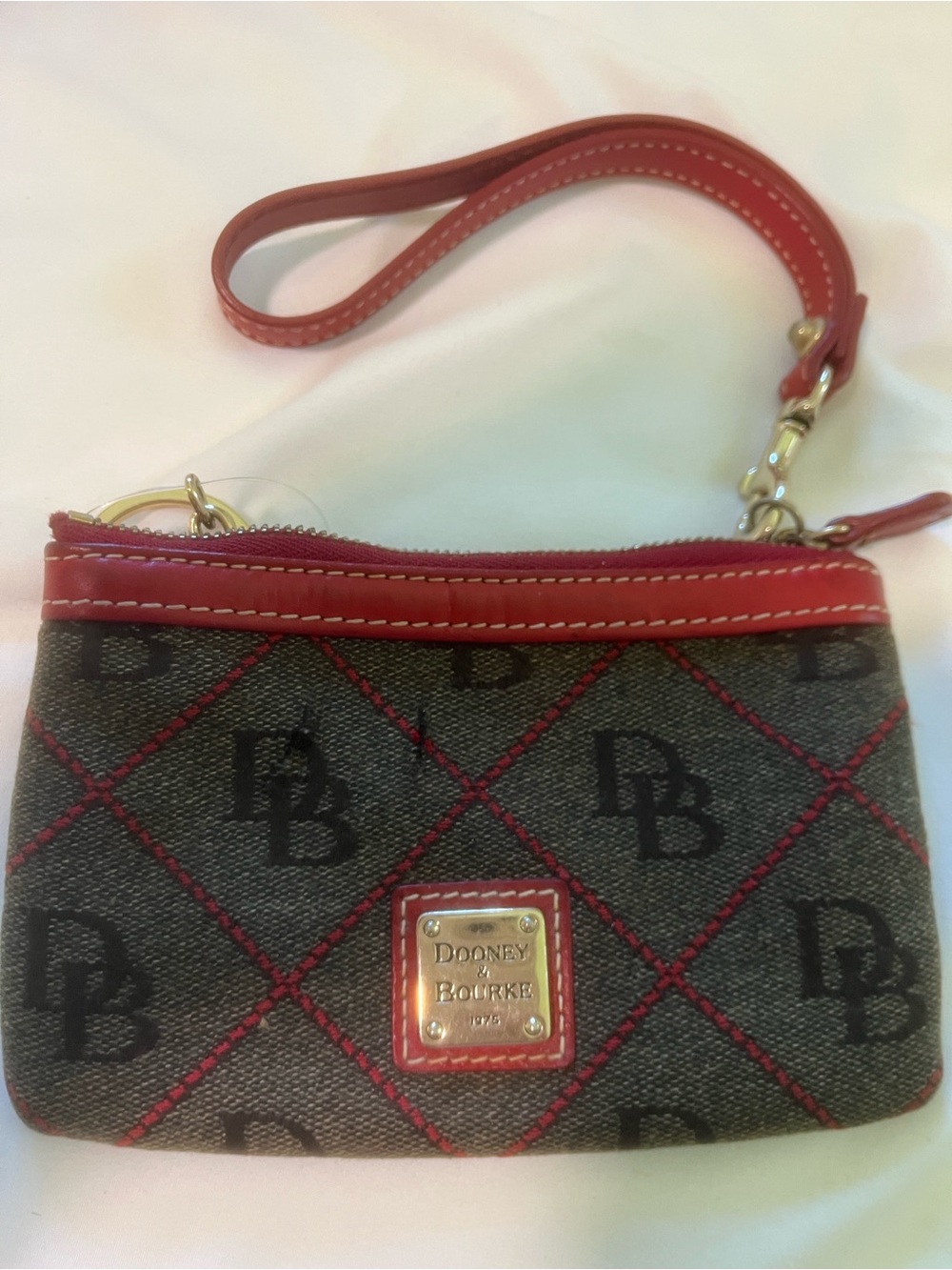 Dooney & Bourke Brown Monogram Wristlet with Red Trim
